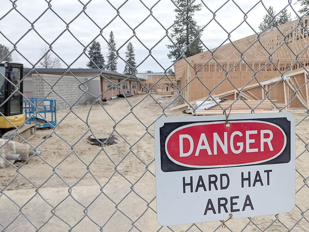 Fence with sign that reads "DANGER: Hard Hat Area" | Deer Park Gazette