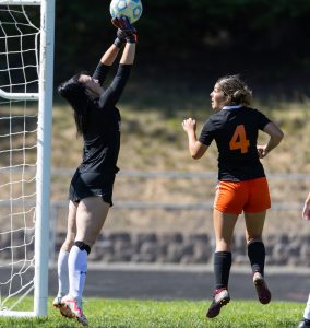 Riverside's keeper Mariah Mally pushes the Spartan shot over the crossbar to preserve the shutout.