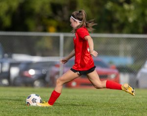 Ashlee Clauson strikes the ball for a penalty kick goal against Newport.