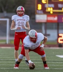 Senior #13 Jake Gaffaney surveys the Shadle Park defense.