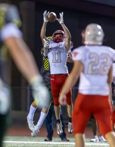 #11 Blake Koesel goes up for the interception but the ball is knocked away at the last second by the Shadle Park receiver.