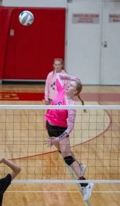 Riverside's Kaylee Winterroth spikes it against Deer Park.